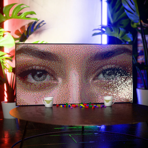 Eye Model Woman made out of 13,433 LEGO-Compatible bricks on a table with stylish luxury studio background.