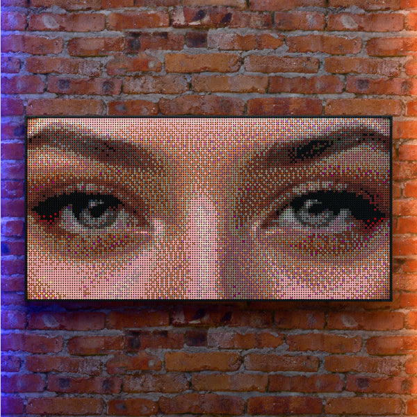 Eye Model Woman made out of 13,433 LEGO-Compatible bricks on a real red-brick wall background with good lighting.