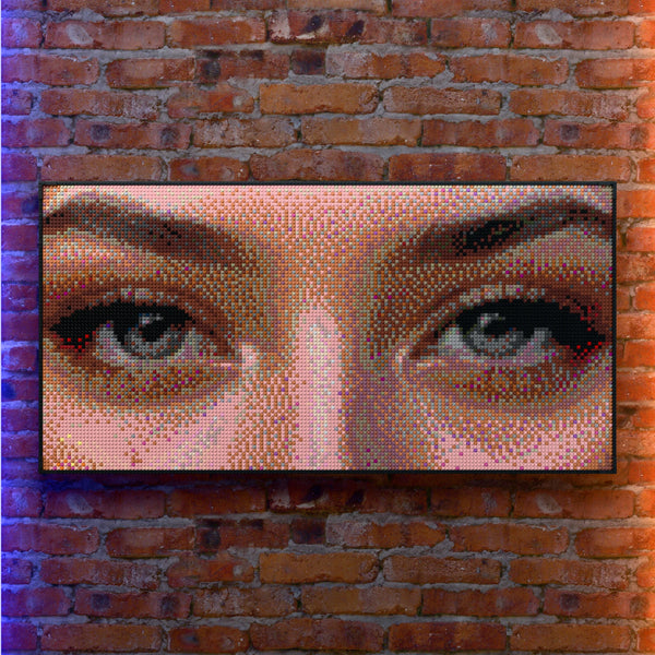 Eye Model Woman made out of 13,433 LEGO-Compatible bricks on a real red-brick wall background with good lighting, built with 1x1 square plates.
