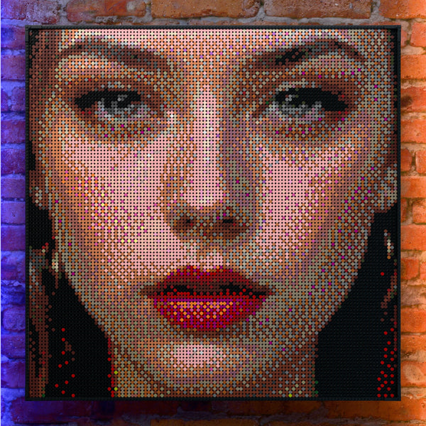 Eye Model Woman made out of 13,153 LEGO-Compatible bricks on a real red-brick wall background with good lighting.